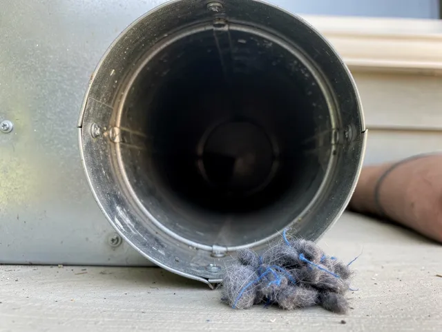 Fountainebleau Dryer Vent Cleaning technician using specialized equipment to clear severe dryer vent blockage in Fountainebleau